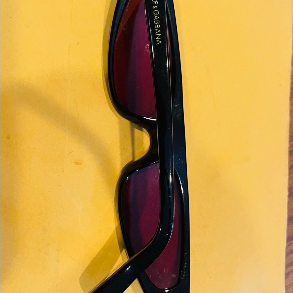 Dolce & Gabbana Black Frame Sunglasses with Red Tint